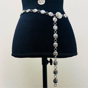 Silver tone western belt with silver tone buckle